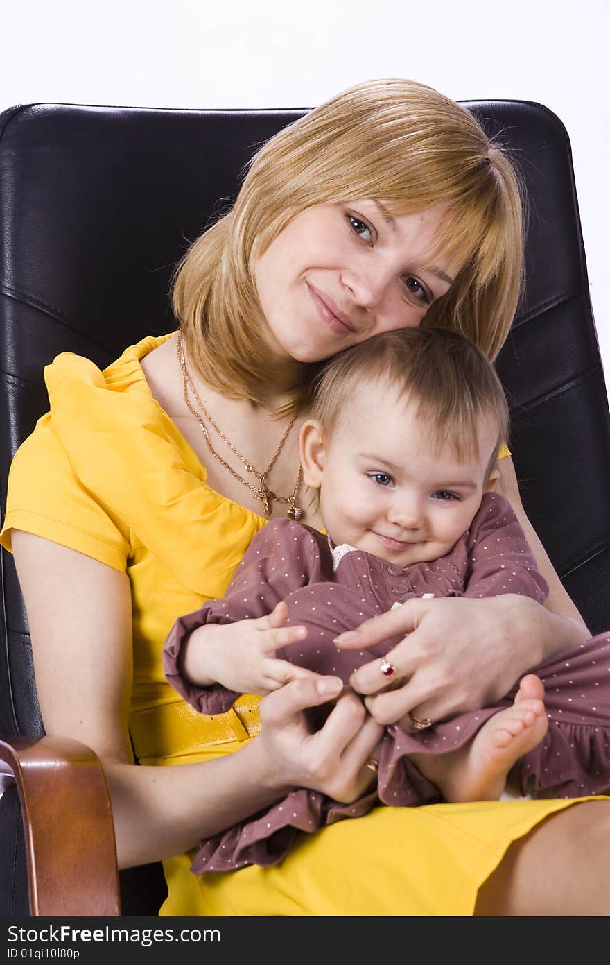 Mother and daughter sitting in a chair