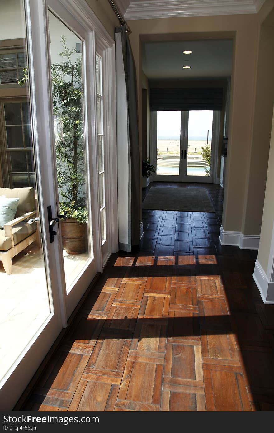 Luxury home hallway with a hardwood floor.