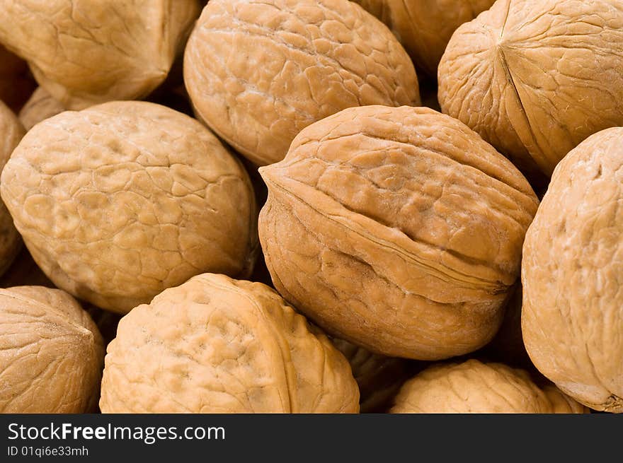 Background of walnuts, close up studio shot.