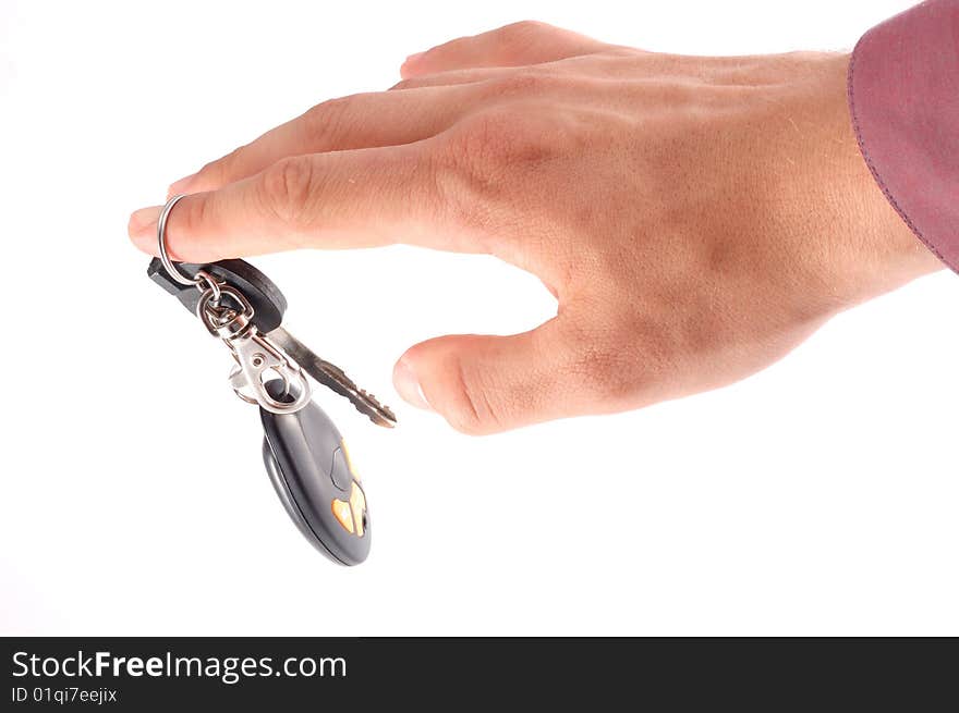 Car keys on a hand on a white background