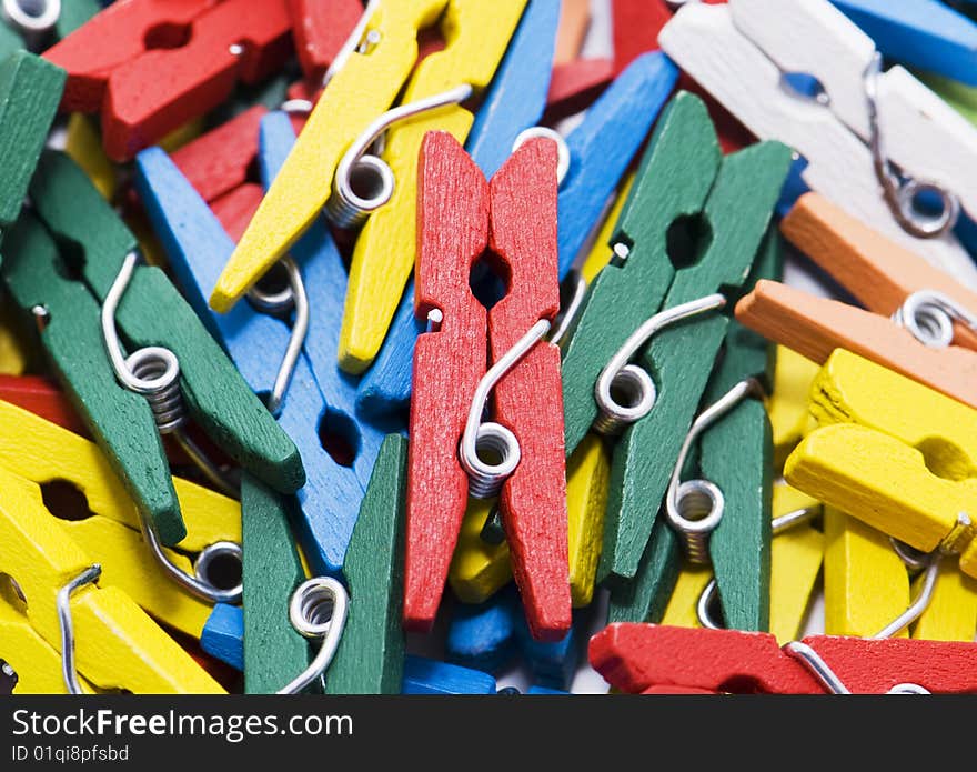 Many small colour writing clothespins