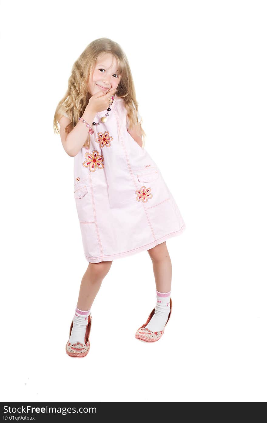 Shot of little girl playing with big mom shoes in studio