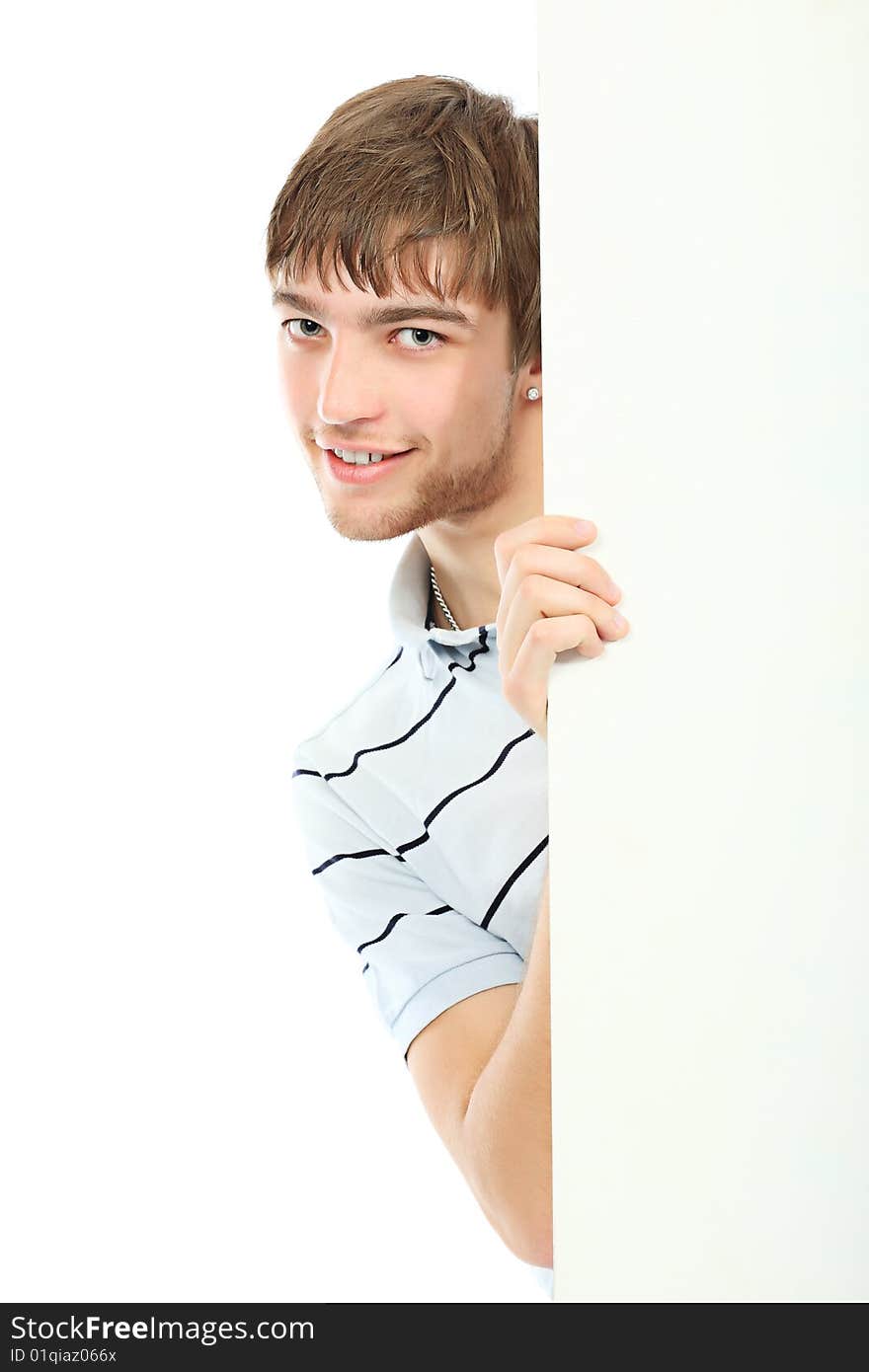 Portrait of a handsome young man holding a billboard. Shot in a studio. Portrait of a handsome young man holding a billboard. Shot in a studio.