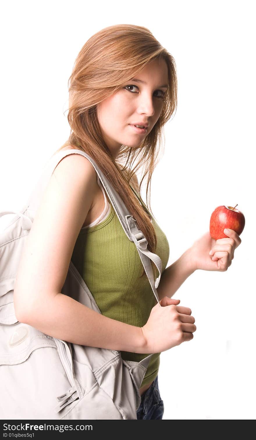 Young and beautiful student with apple and books