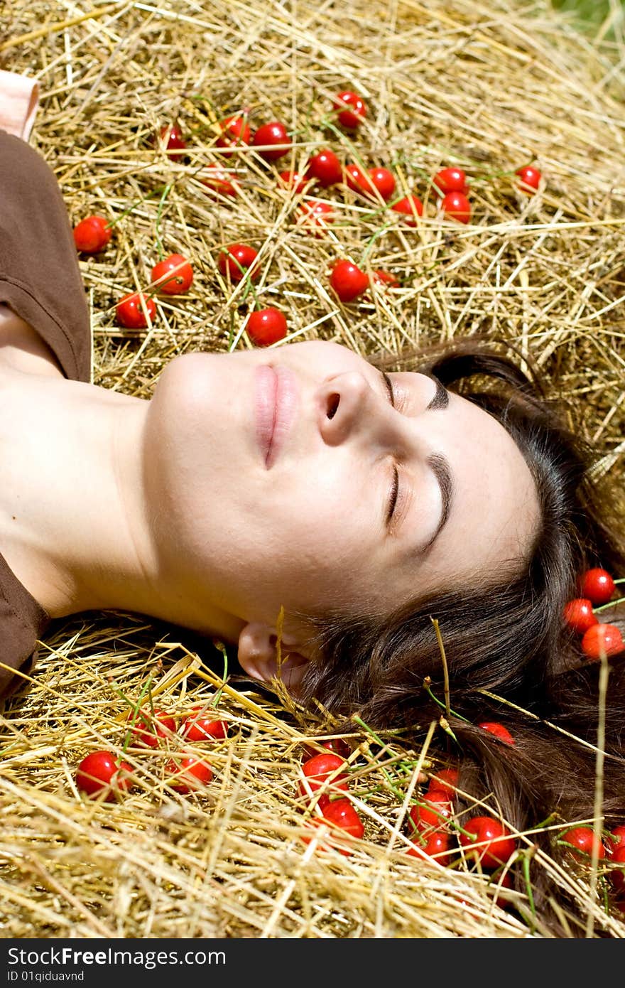 Portrait of the happy girl with cherry