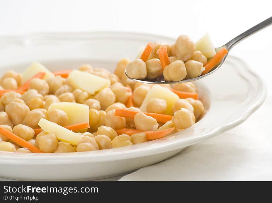 Chickpeas delicious homemade carrot and potato dish isolated. Chickpeas delicious homemade carrot and potato dish isolated