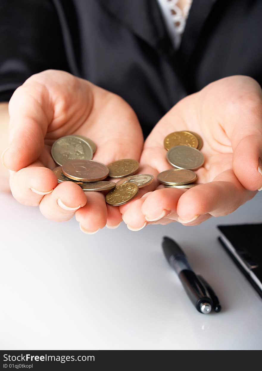 Handful of coins in female hands