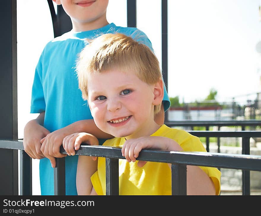 Two boys play  in the spring. Two boys play  in the spring