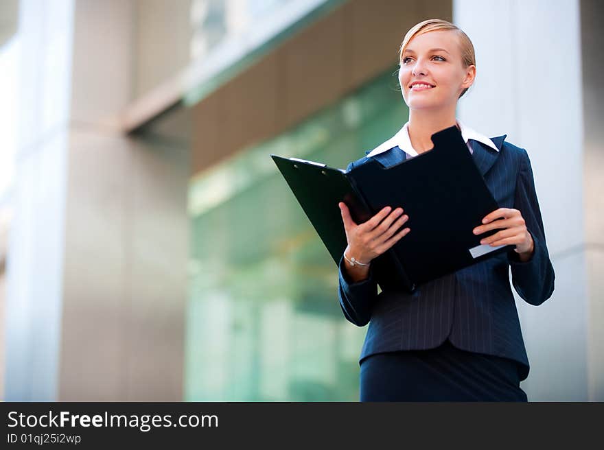 A Beautiful Businesswoman Holding A Clipboard