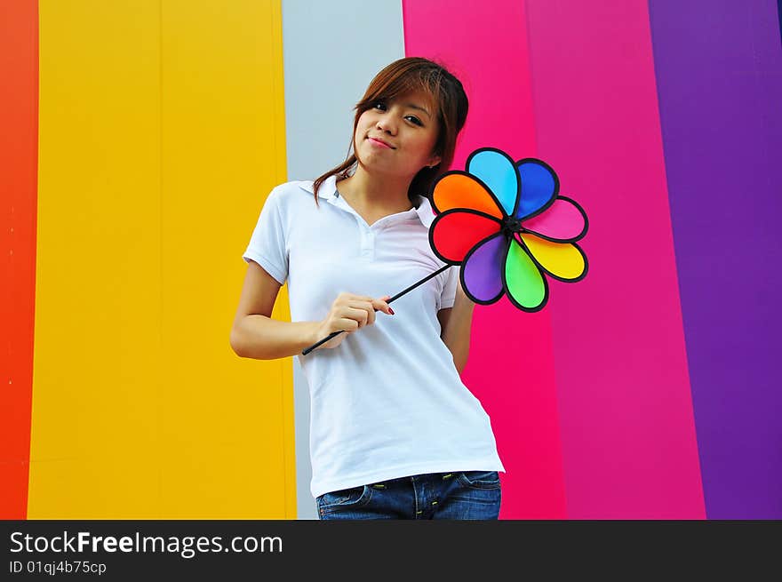 Smiling beautiful young Asian woman with colourful background. Smiling beautiful young Asian woman with colourful background.