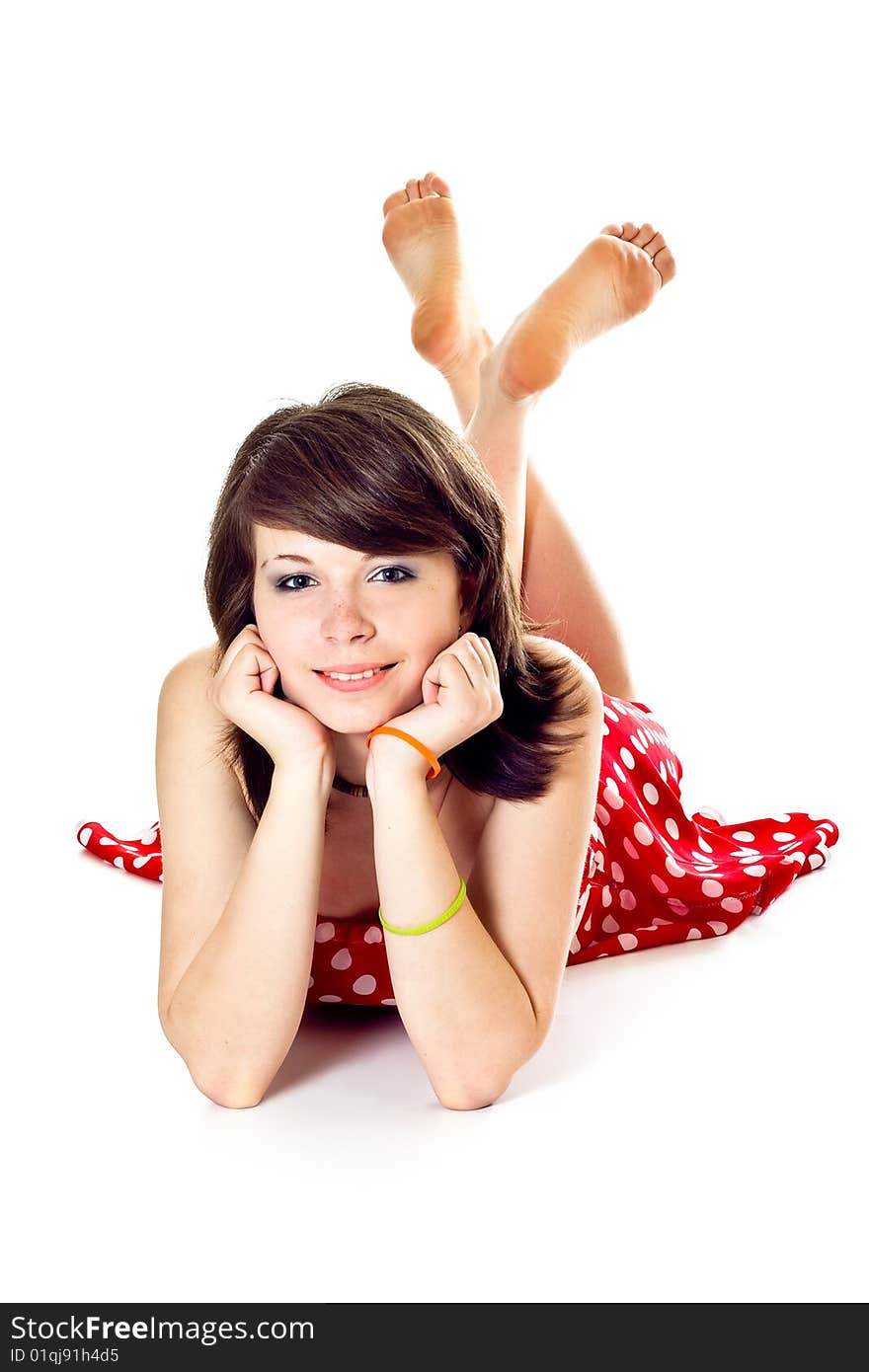 Young pretty girl in dot polka dress on white background