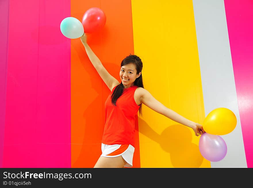 Young Asian Woman Holding Balloons