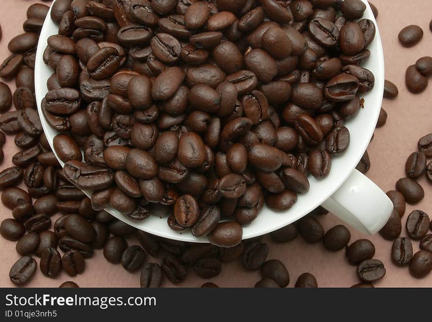 Coffee beans in cup