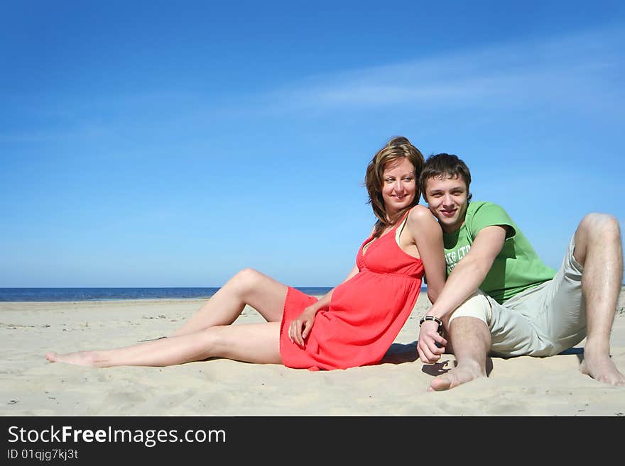 Young couple relaxing on the beach. Young couple relaxing on the beach