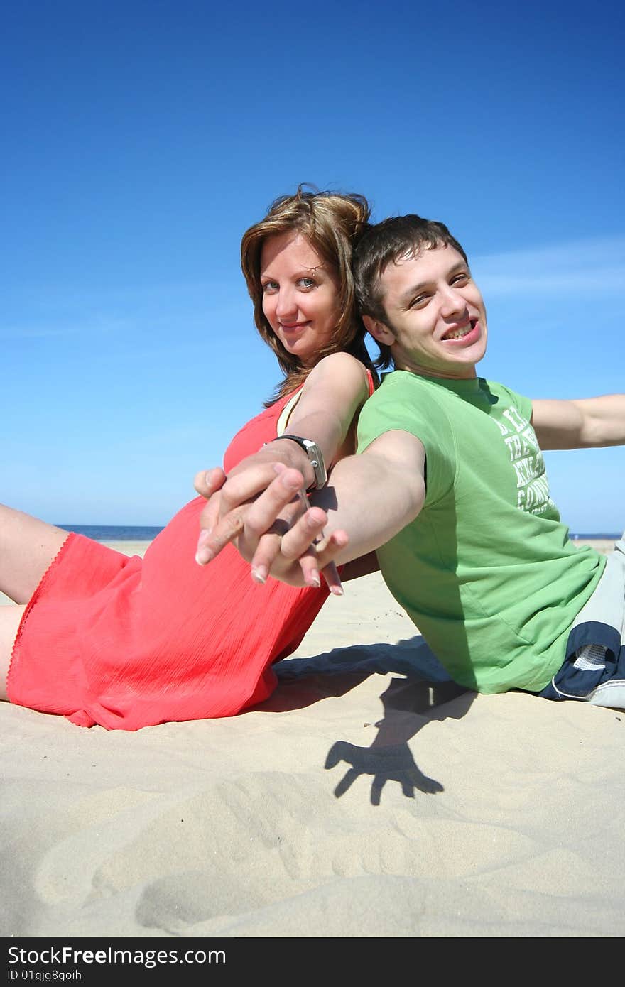 Young couple relaxing on the beach. Young couple relaxing on the beach