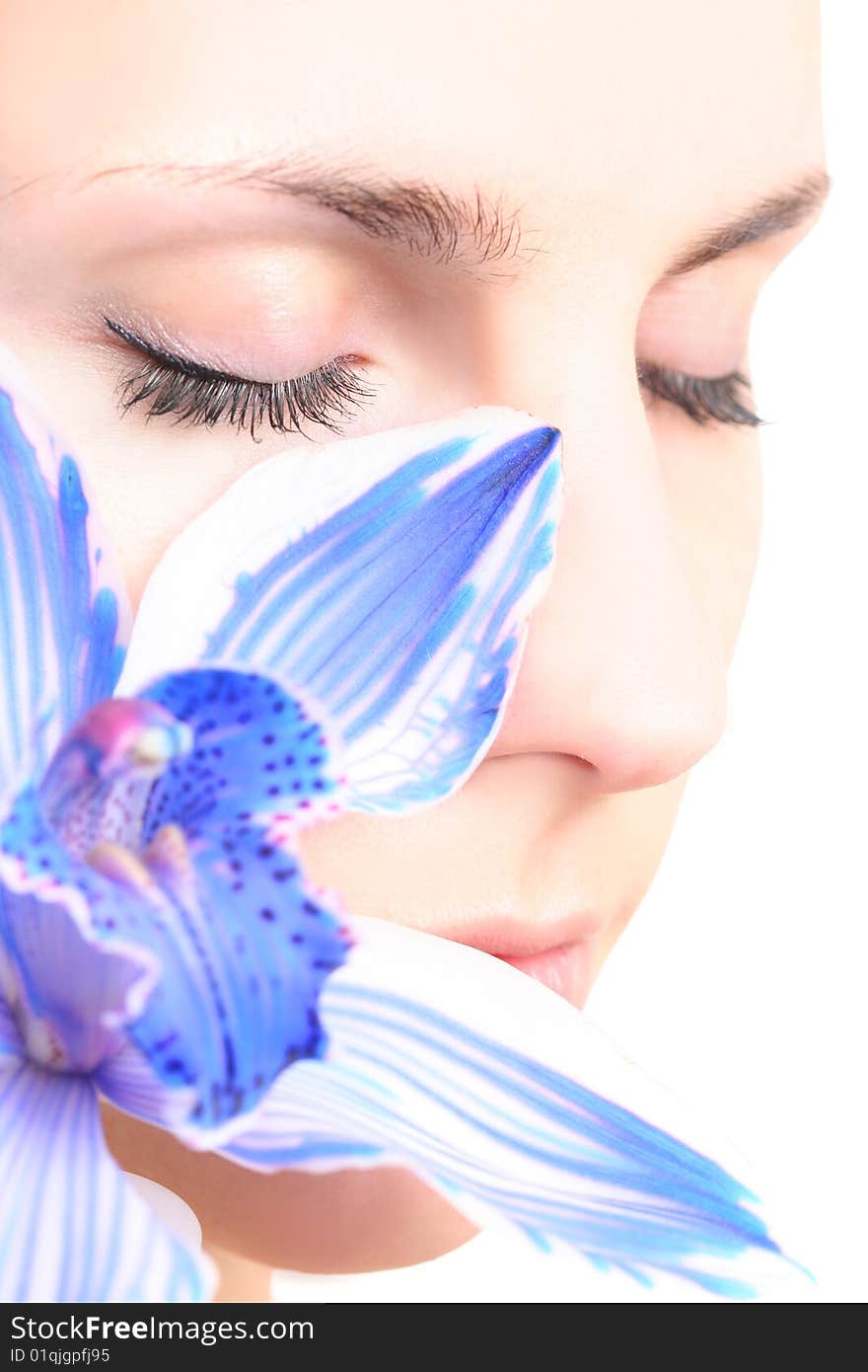 Young girl with blue orchid. Young girl with blue orchid