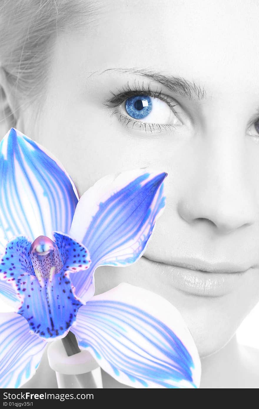 Young girl with blue orchid. Young girl with blue orchid