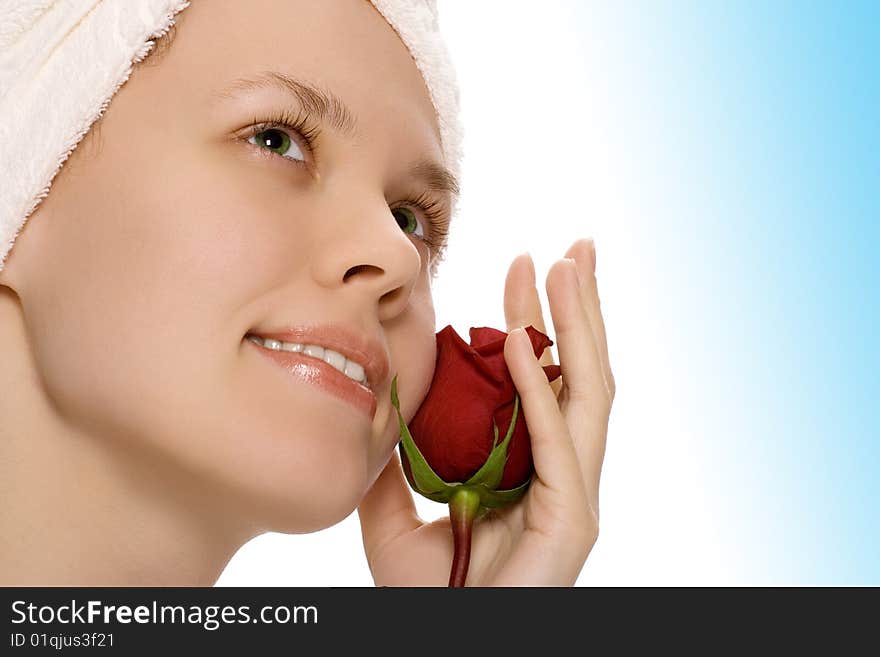 Beauty girl in towel with rose after shower