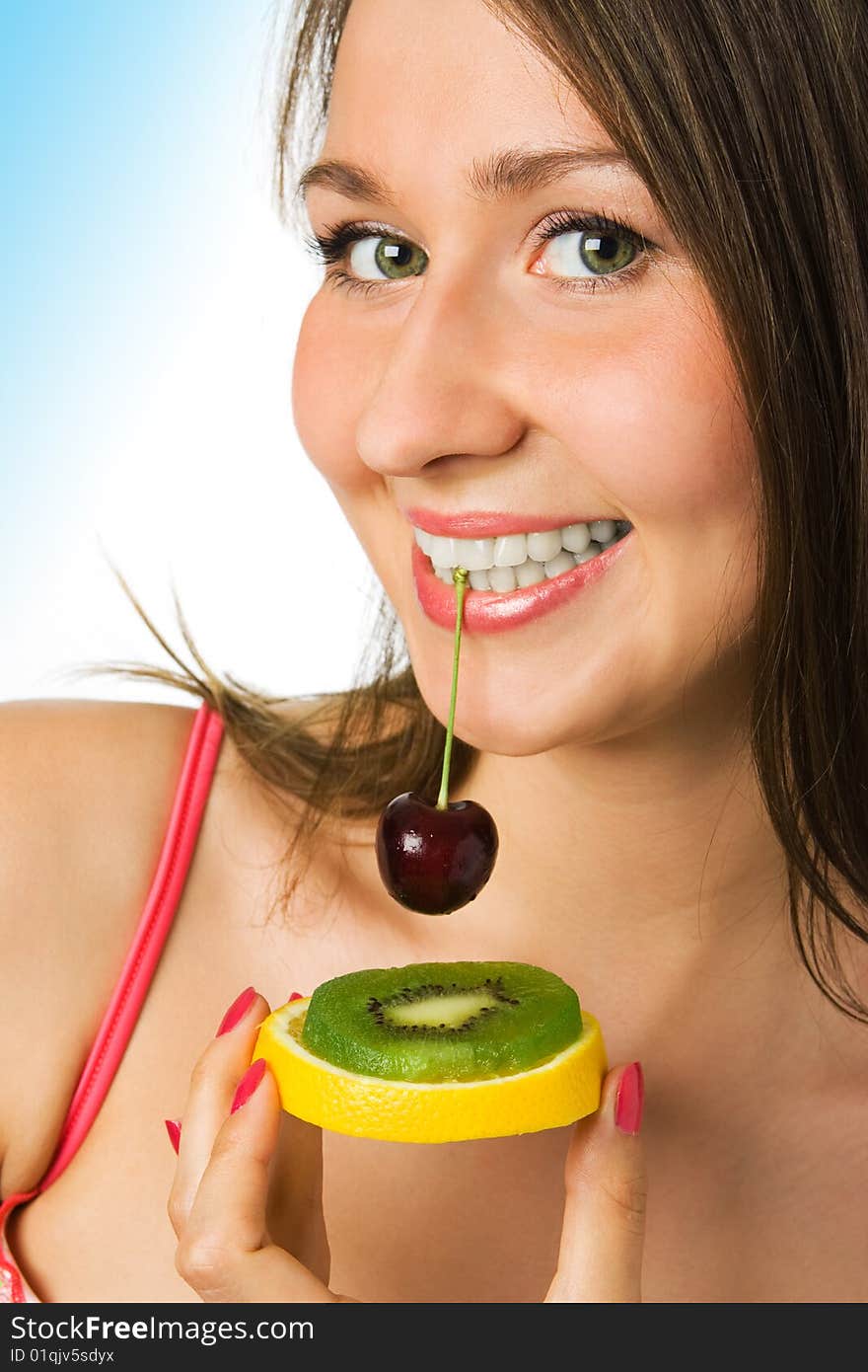 Beauty woman with fruit on white