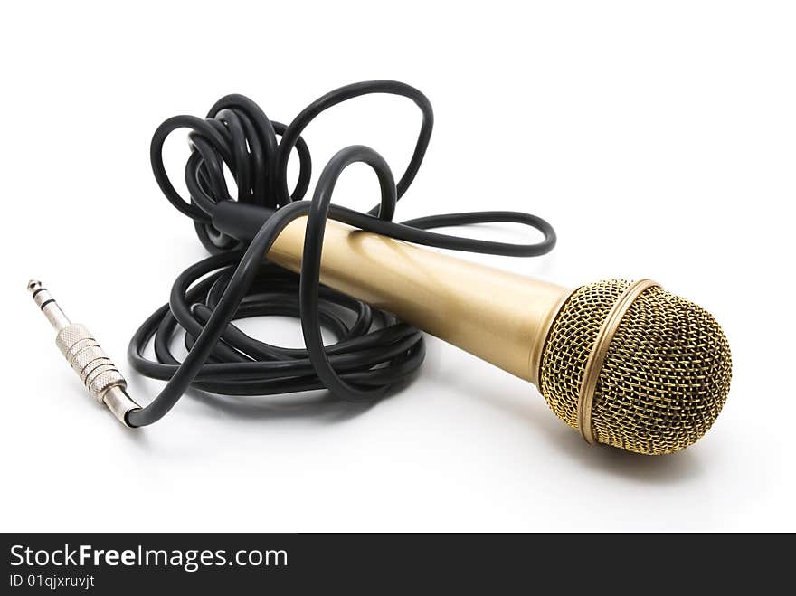 Old golden microphone with a black wire