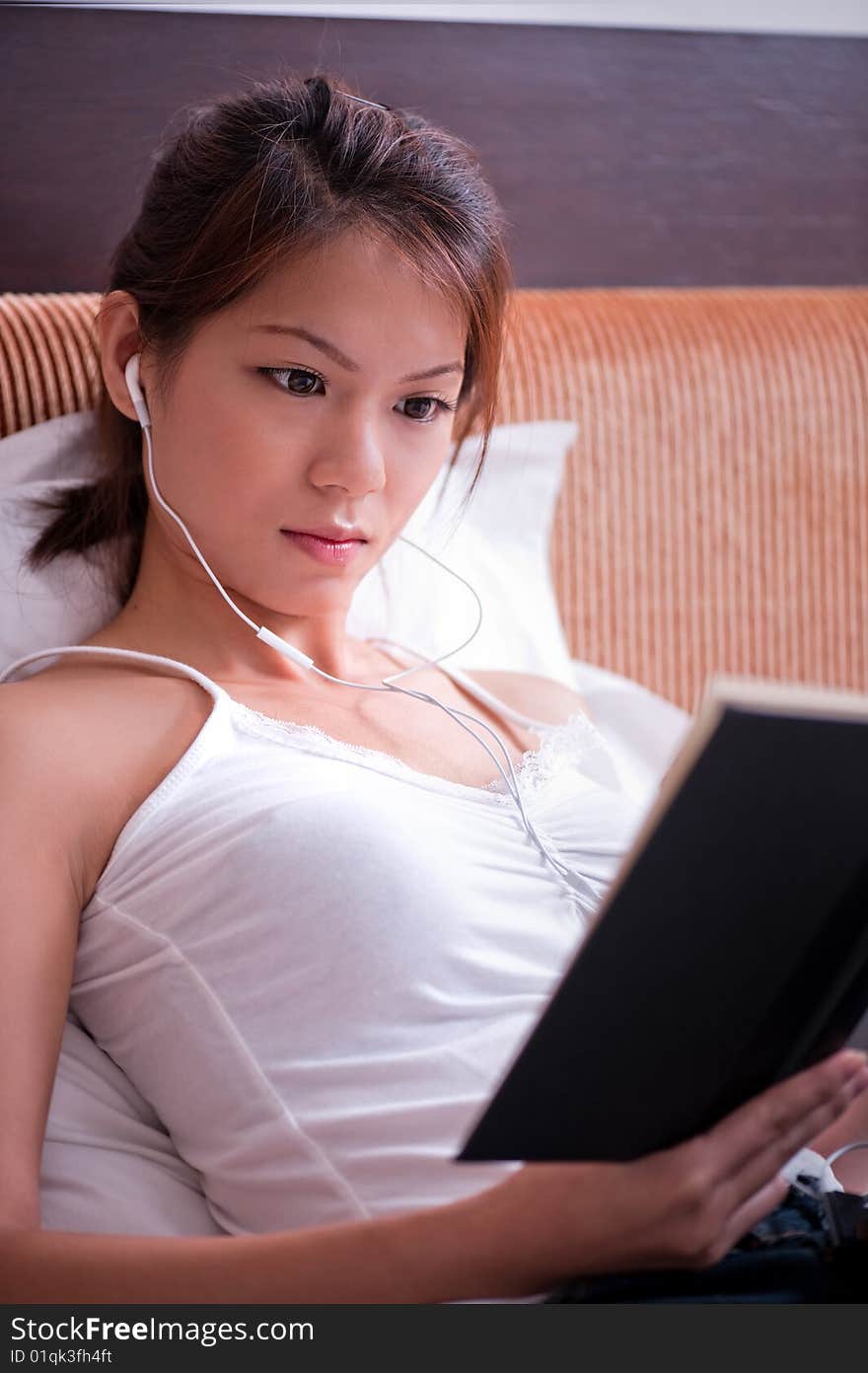 An image of an asian female student studying. An image of an asian female student studying