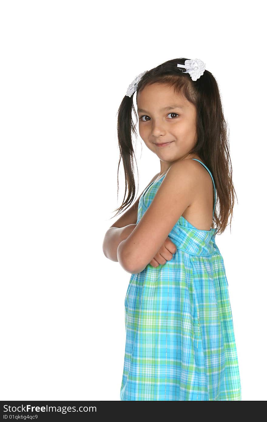 Cute multi racial girl grinning with arms crossed. Cute multi racial girl grinning with arms crossed