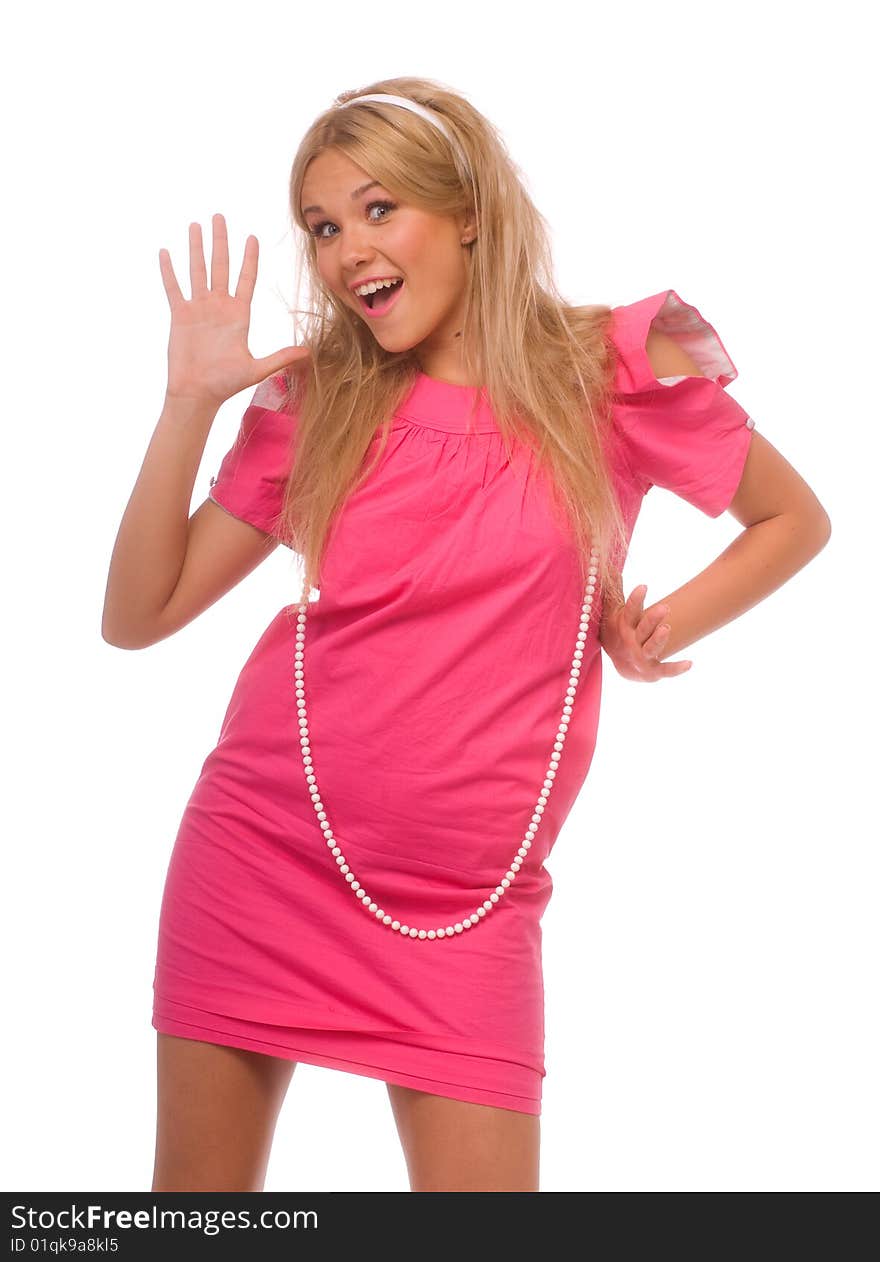 A young beautiful blonde in pink short dress with embellishment of pearls around her neck. A young beautiful blonde in pink short dress with embellishment of pearls around her neck