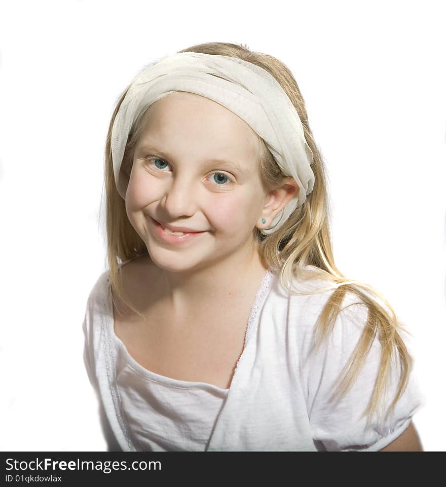 Girl in white with blue eyes smiling