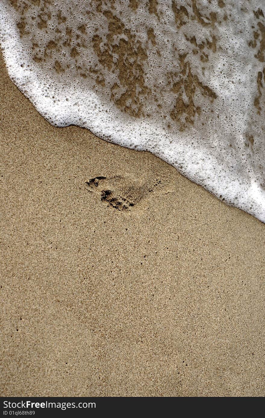 Footprint in the sand along the shore. Footprint in the sand along the shore