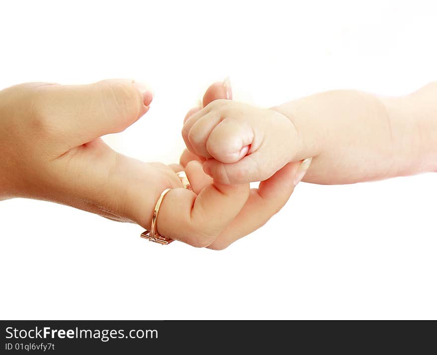 Baby's and mother's hands over white