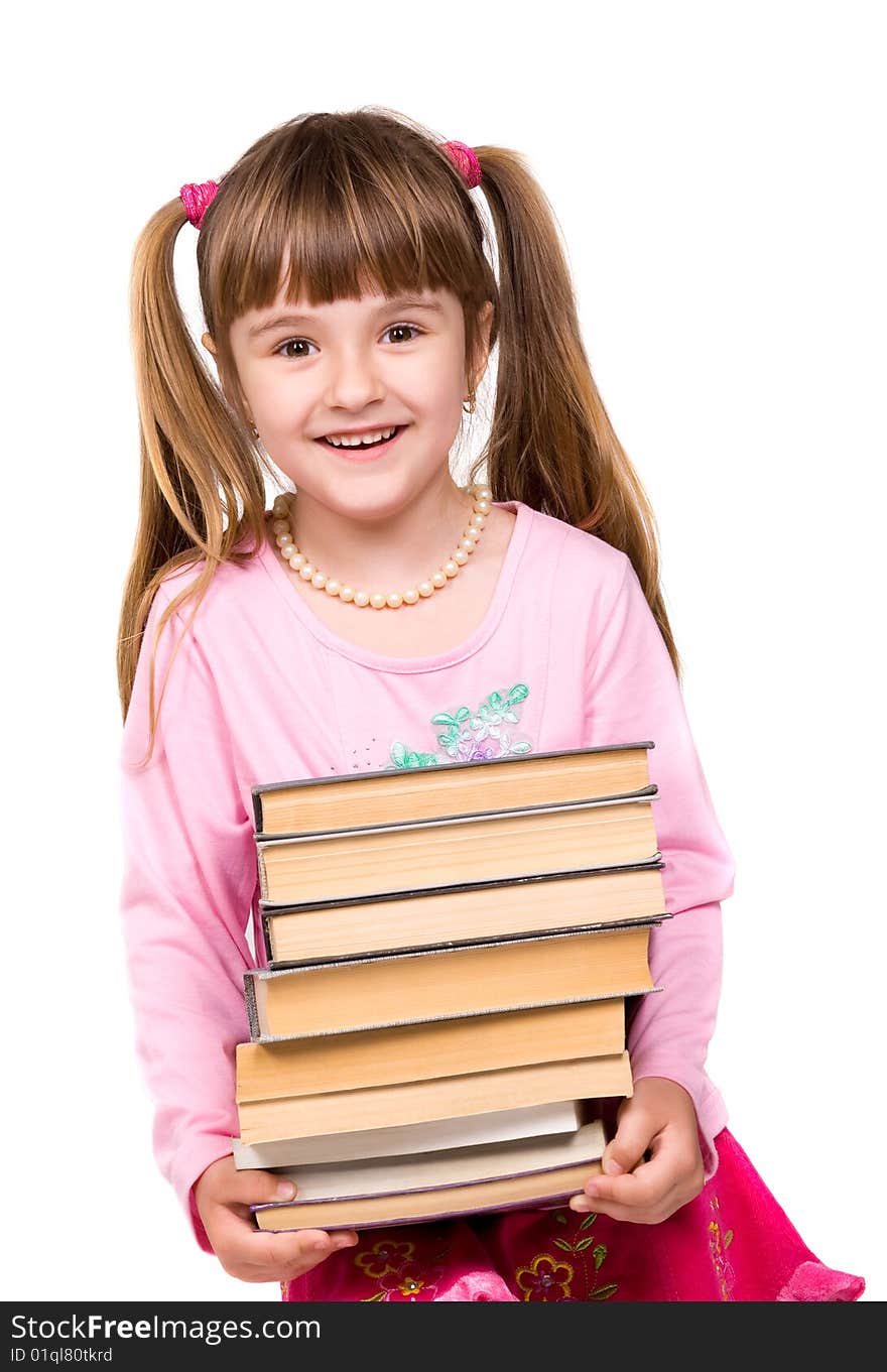 Pretty little girl holding stack of books