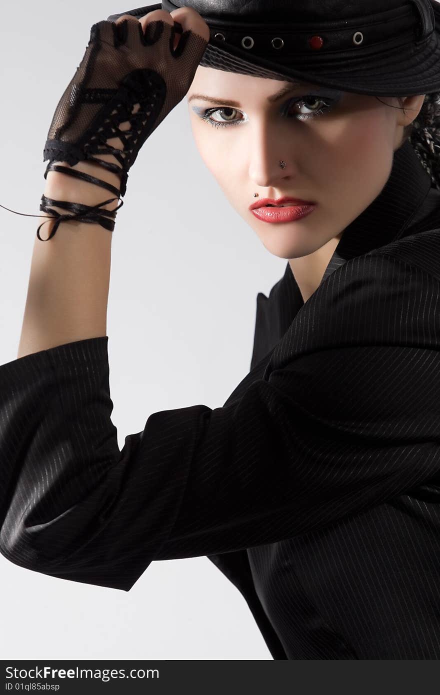 Young fashionable model with black hat