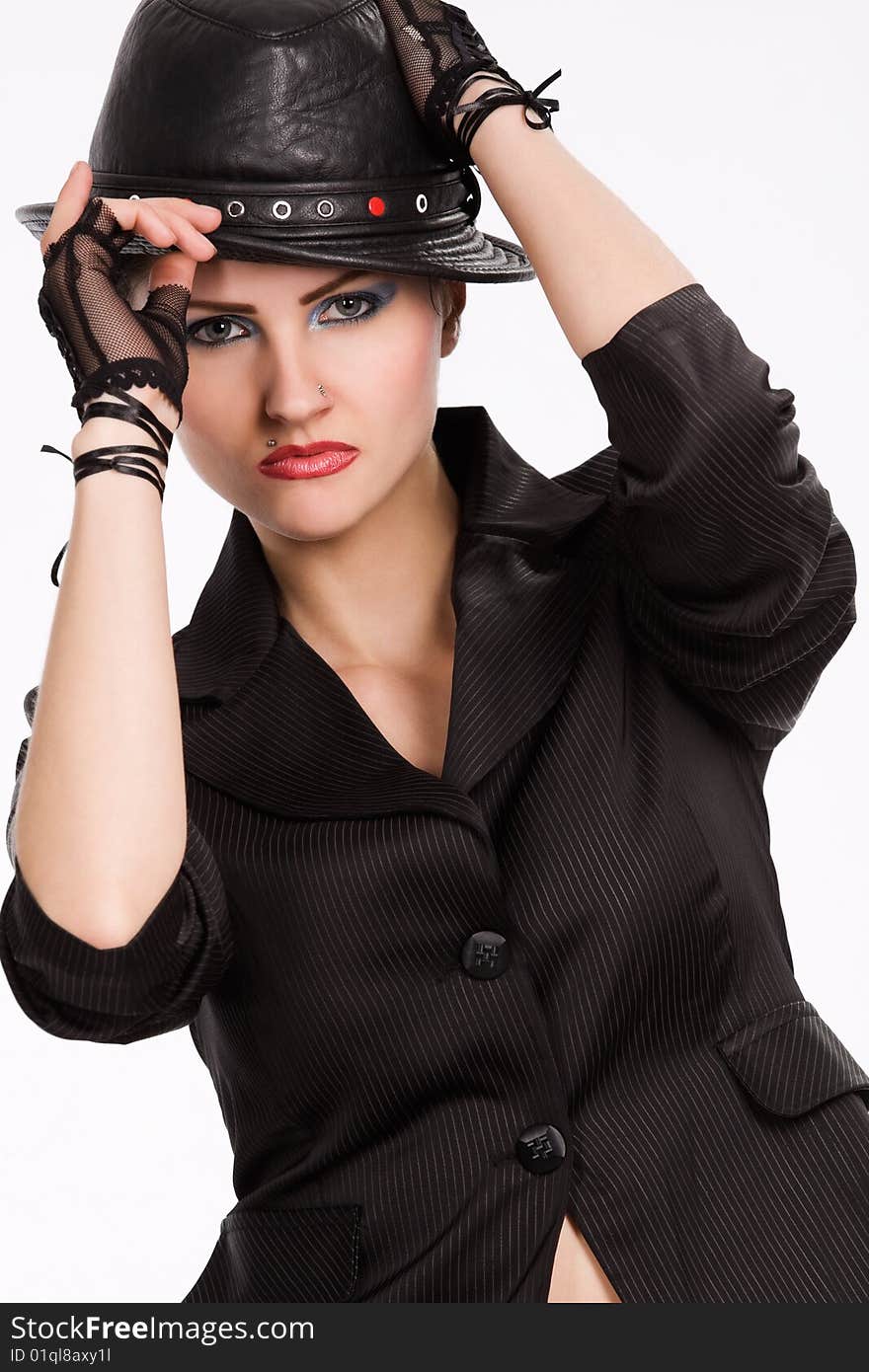 Young fashionable model with black hat