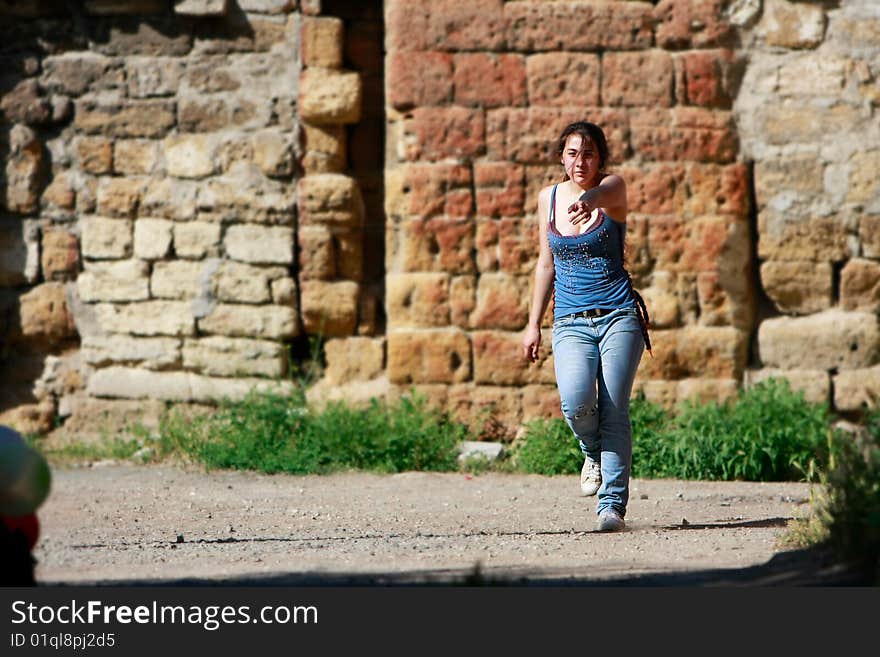 Teen girl walking on grunge background