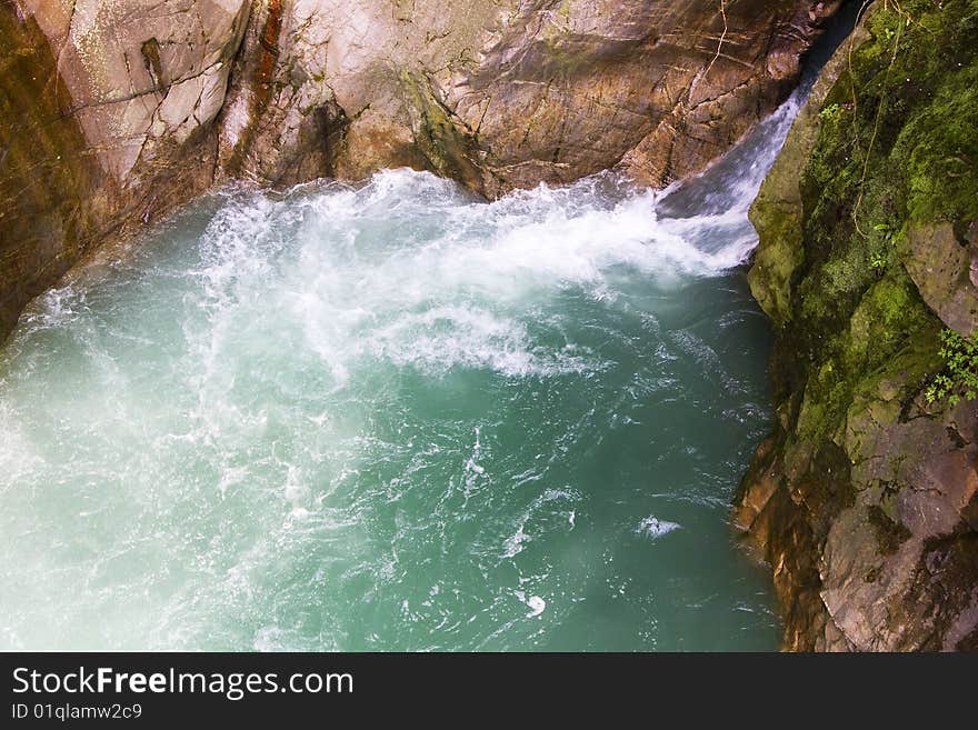 Scroll of a stream between the rocks. Scroll of a stream between the rocks