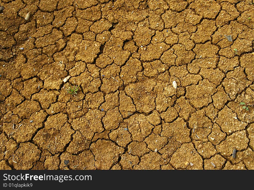 Dry loamy soil in the summer. Dry loamy soil in the summer