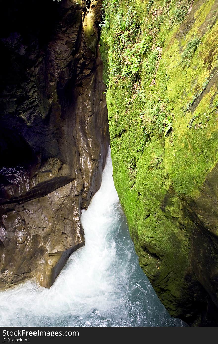 Scroll of a stream between the rocks. Scroll of a stream between the rocks