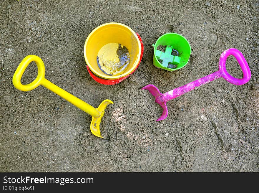 Two shovels and two buckets on sand. Two shovels and two buckets on sand.