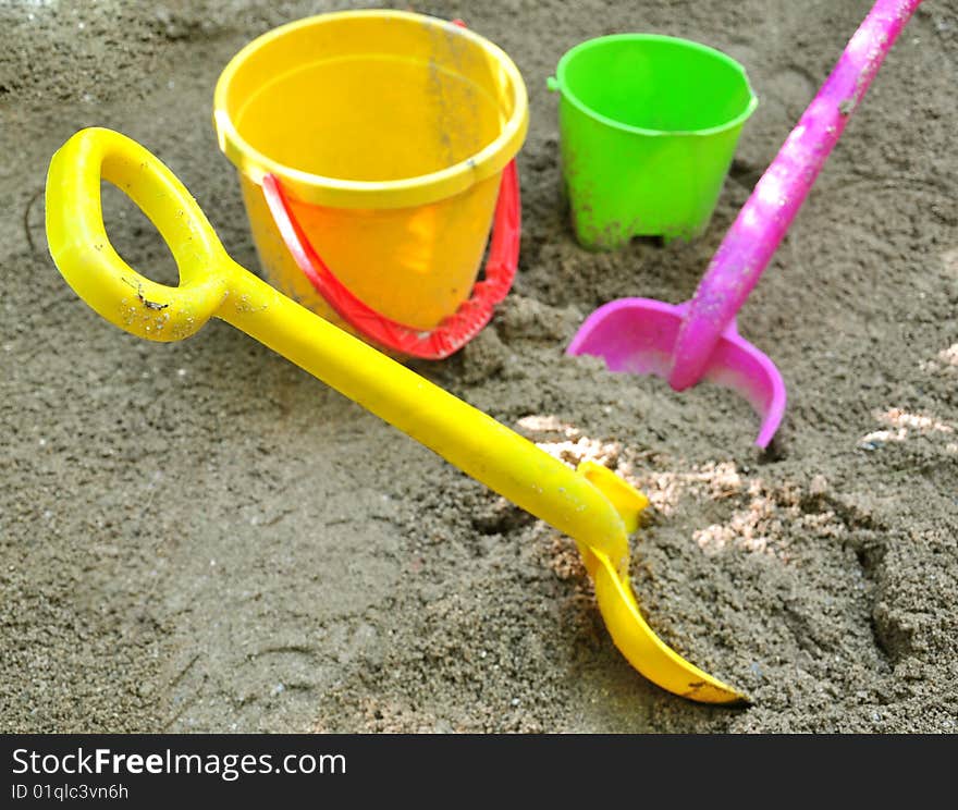 Shovels and buckets, toys on sand. Shovels and buckets, toys on sand