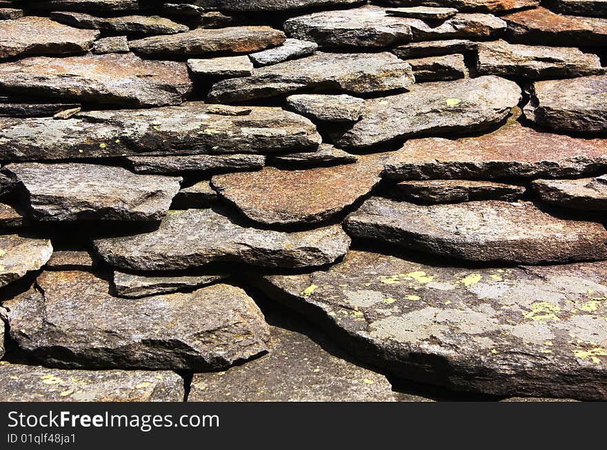 Old roof slabs of rough stone. Old roof slabs of rough stone