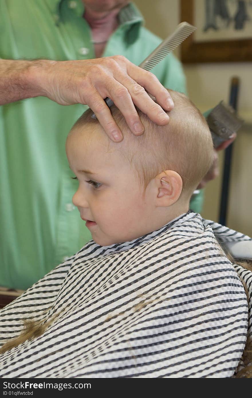 Cute Blue-Eyed Boy Getting his First Hair Cut. Cute Blue-Eyed Boy Getting his First Hair Cut