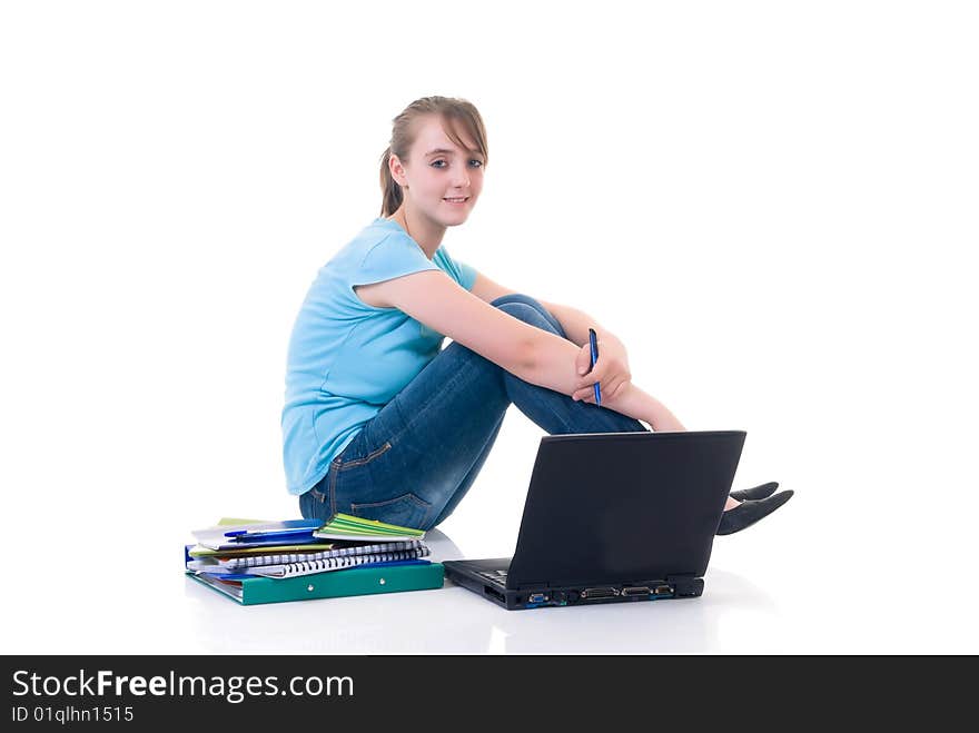 Teenager schoolgirl with laptop on white background