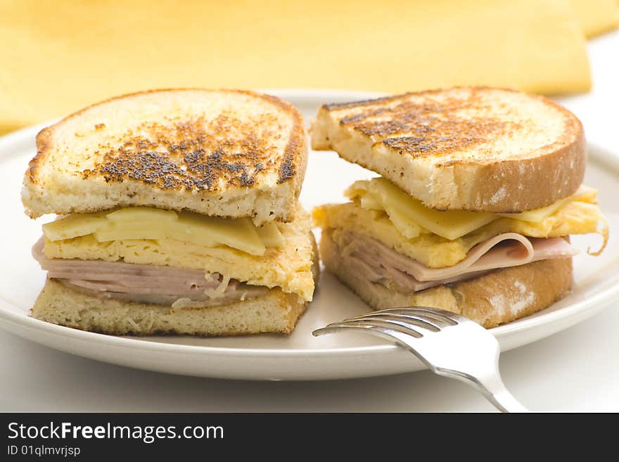 Tasty sandwich of ham and cheese omelet isolated