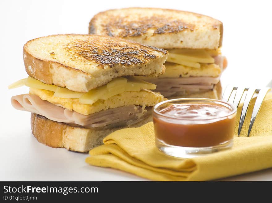 Tasty sandwich of ham and cheese omelet isolated