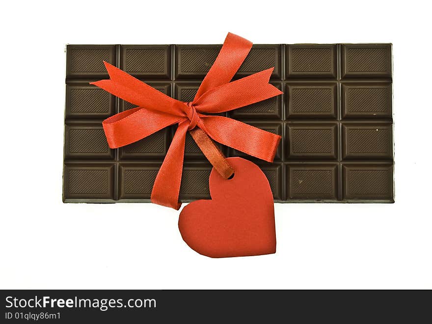 Black chocolate with red ribbon and tag