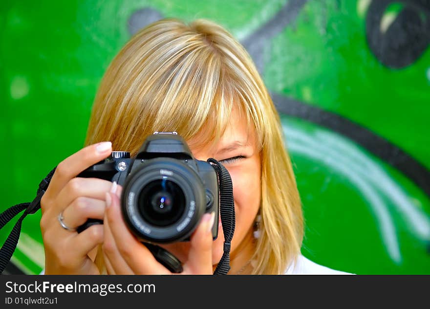 Woman making a picture (focus on face)