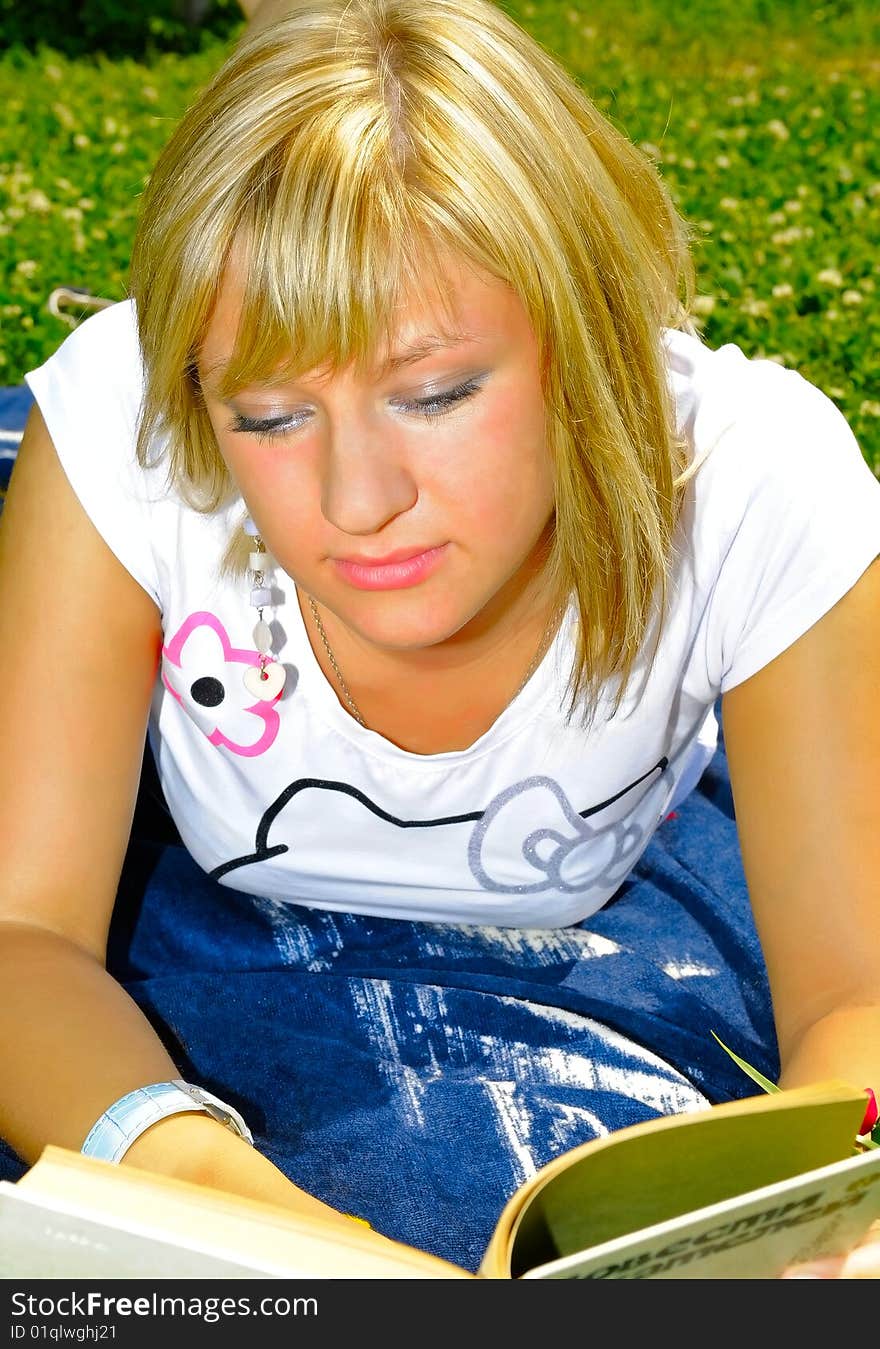 Young attractive woman reading a book. Young attractive woman reading a book