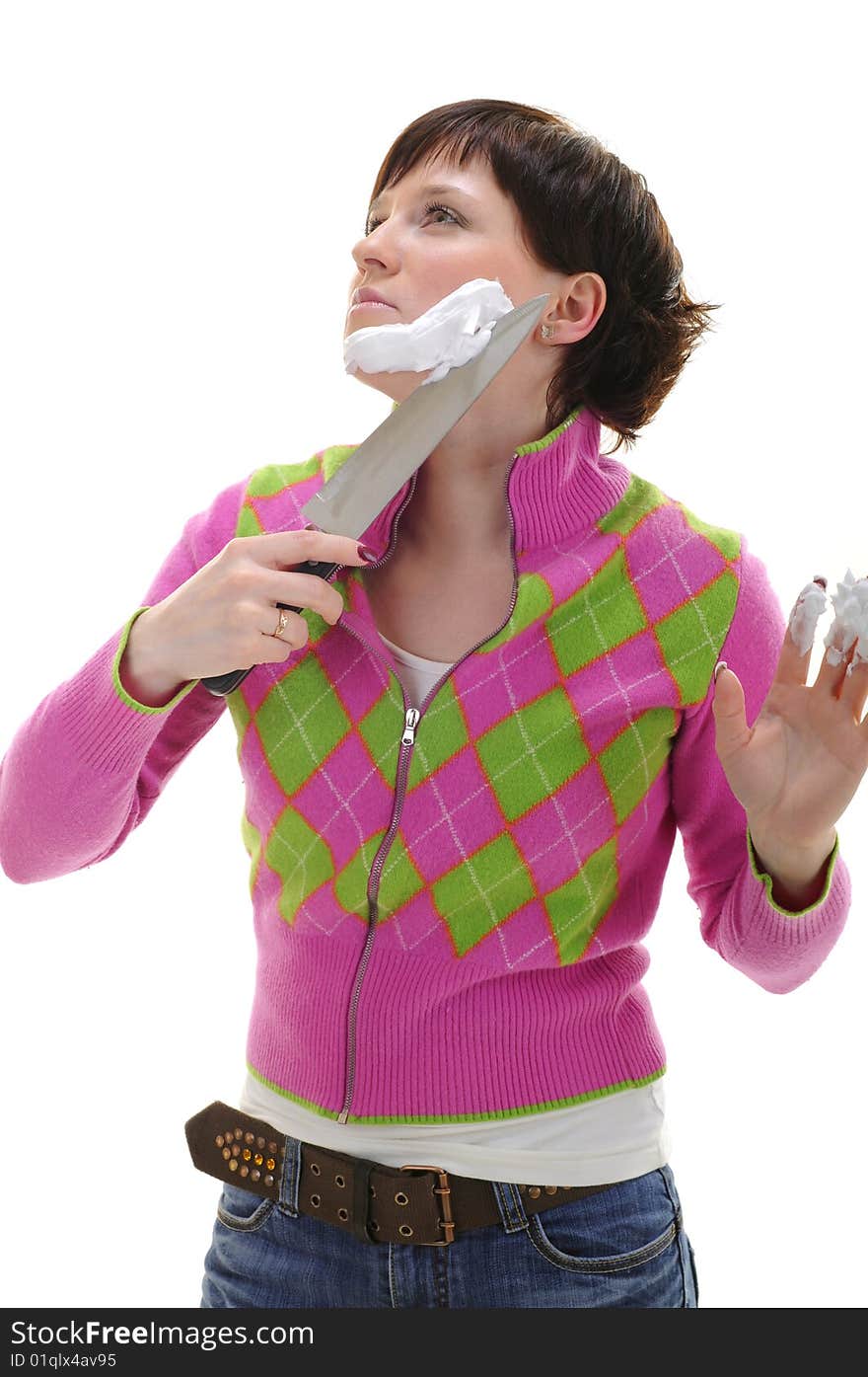 Young woman shaving her face with kitchen knife isolated on white