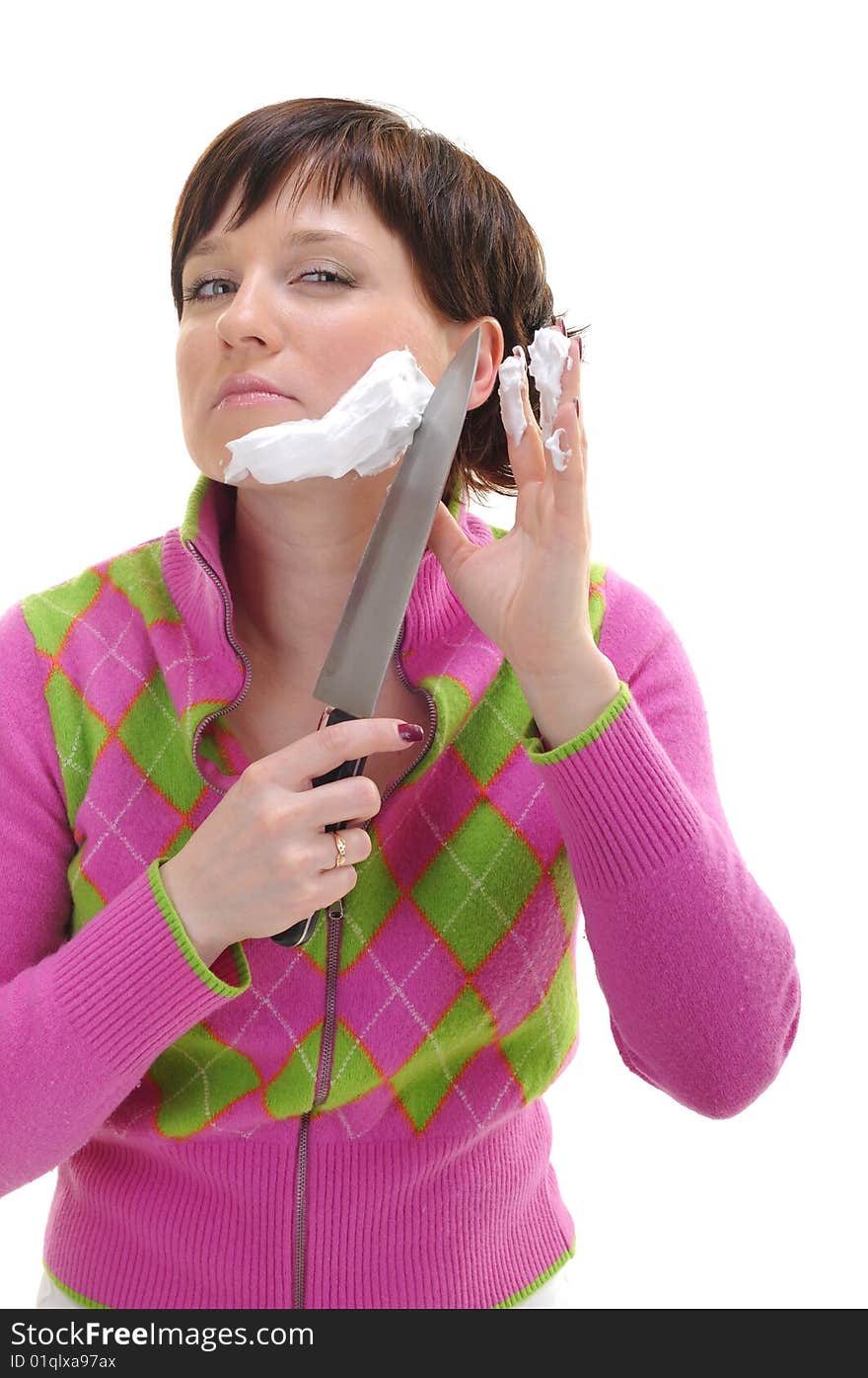 Young woman shaving her face with kitchen knife isolated on white