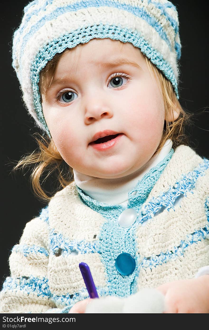 Portrait of little girl in bound suit on black. Portrait of little girl in bound suit on black